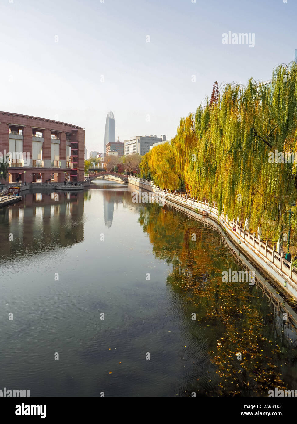 Colorful autumn trees along the canal in Huancheng Park in the city center of Jinan, Shandong province Stock Photo