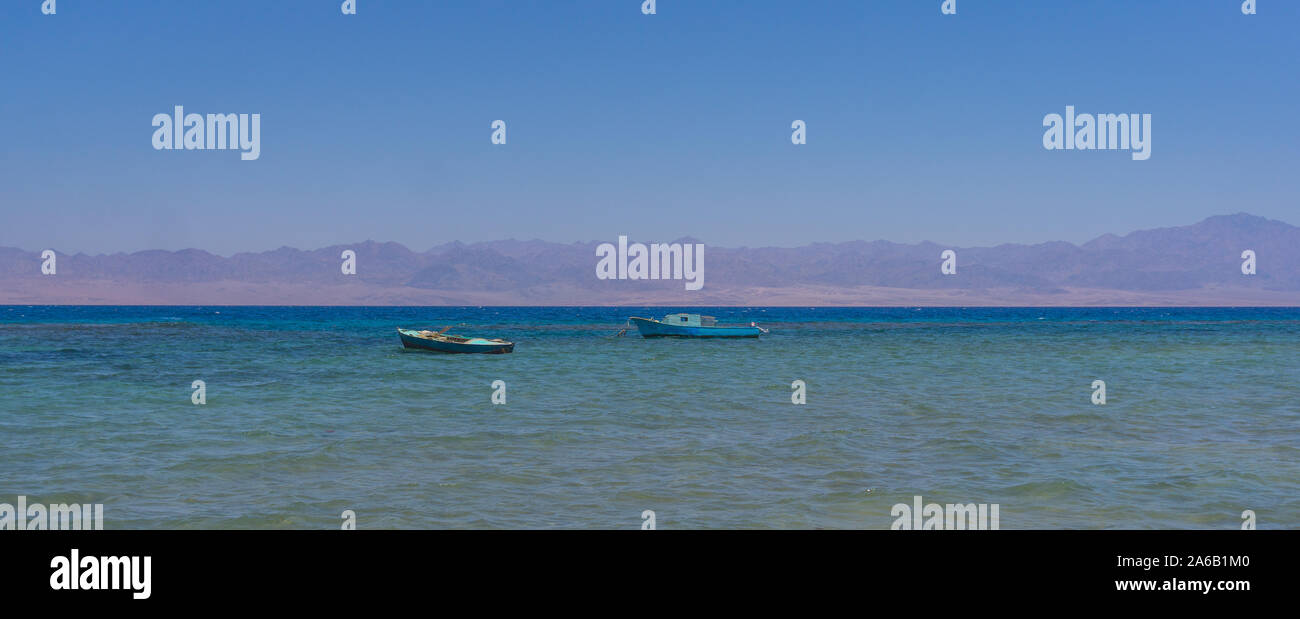 Boats on the crystal clear water in the Red Sea in South Sinai, Egypt. Stock Photo
