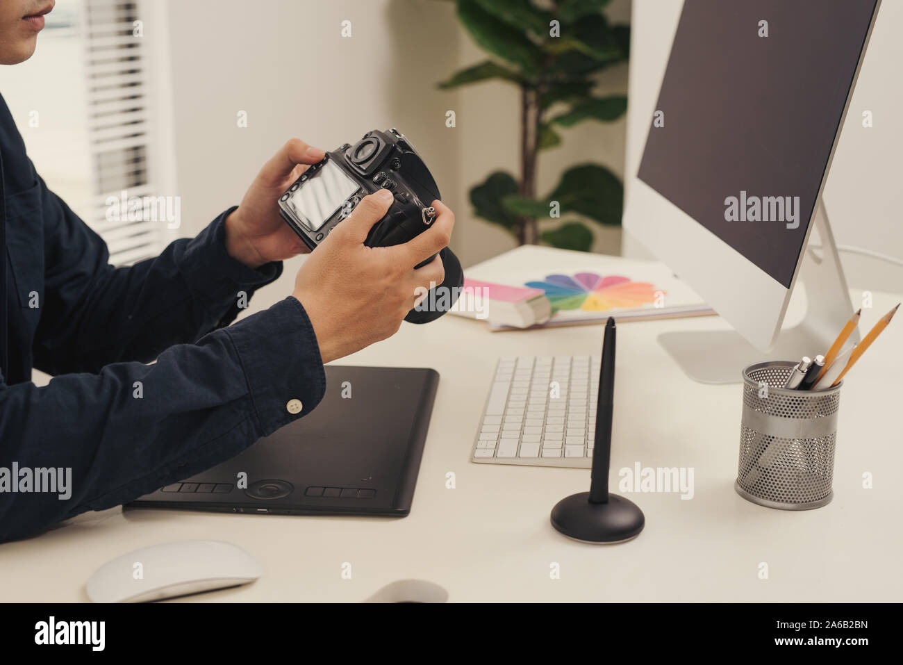 workplace of photographer. Creative designer hands working graphic tablet, photographic