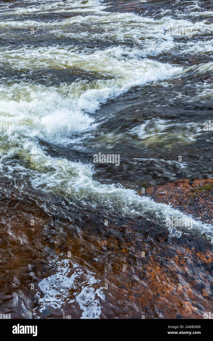 Flowing water in a river Stock Photo