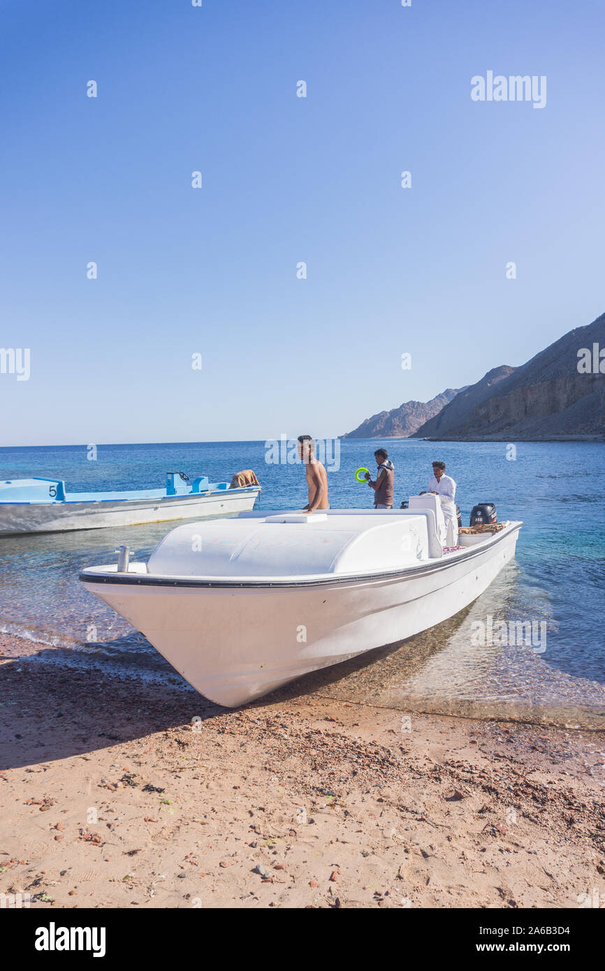 Boats on the crystal clear water in the Red Sea around Ras Abu Galum in South Sinai, Egypt. Stock Photo