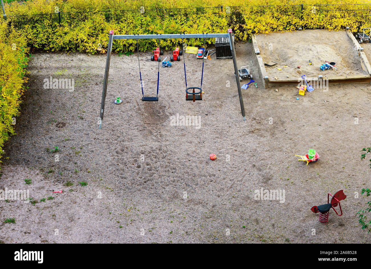 playground, sandpit and swing in the fall, view from above Stock Photo