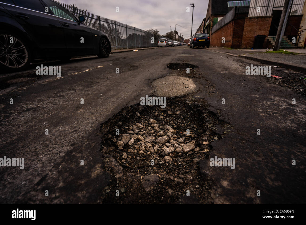 Gouges On Highway Damaged road surfaces, ridden with deep pot holes that cause damage to ...