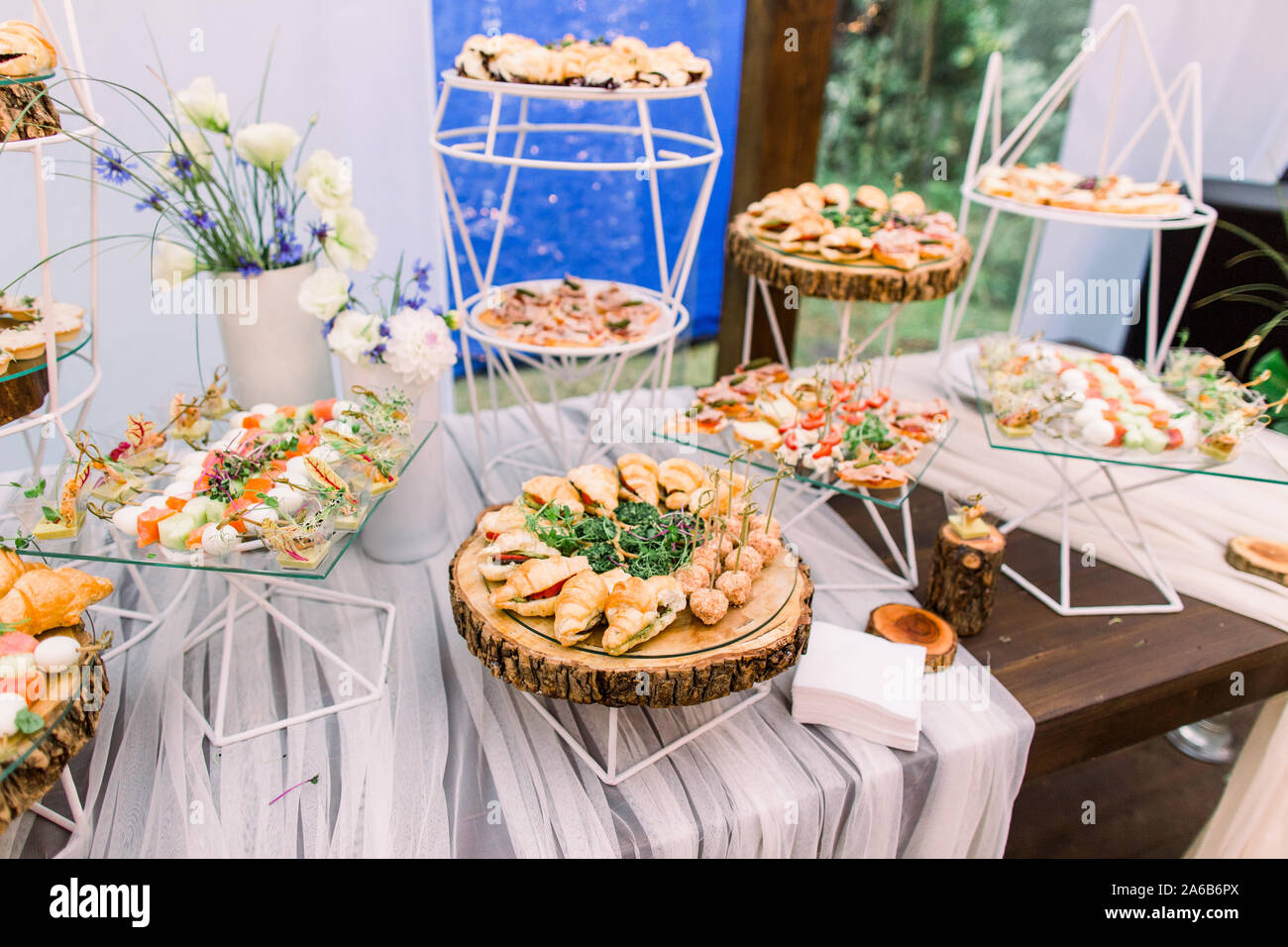 Catering buffet and rustic decor, outdoor wedding party with healthy food  snacks Stock Photo - Alamy