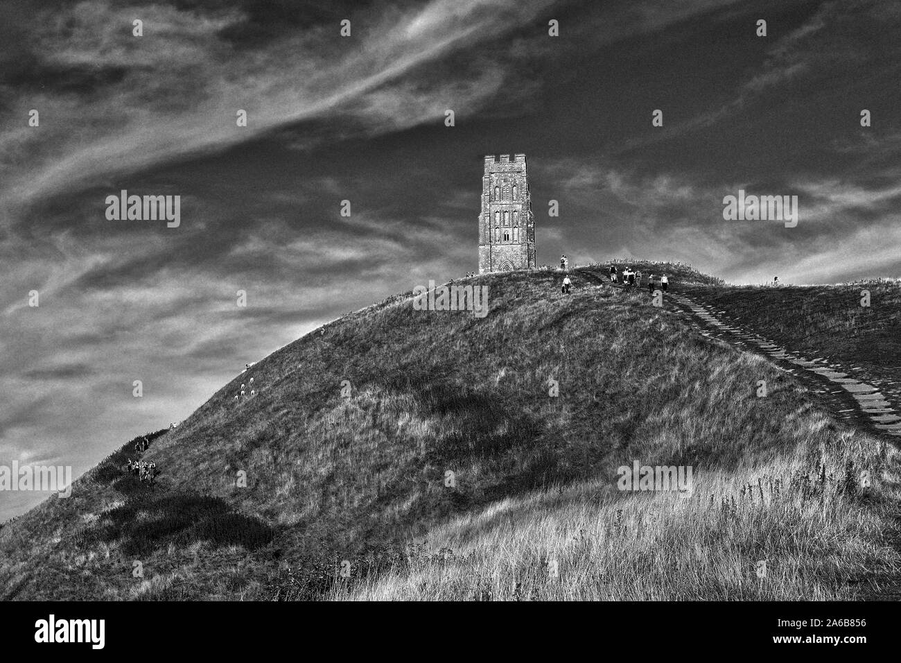 Visitors at Glastonbury Tor Stock Photo Alamy