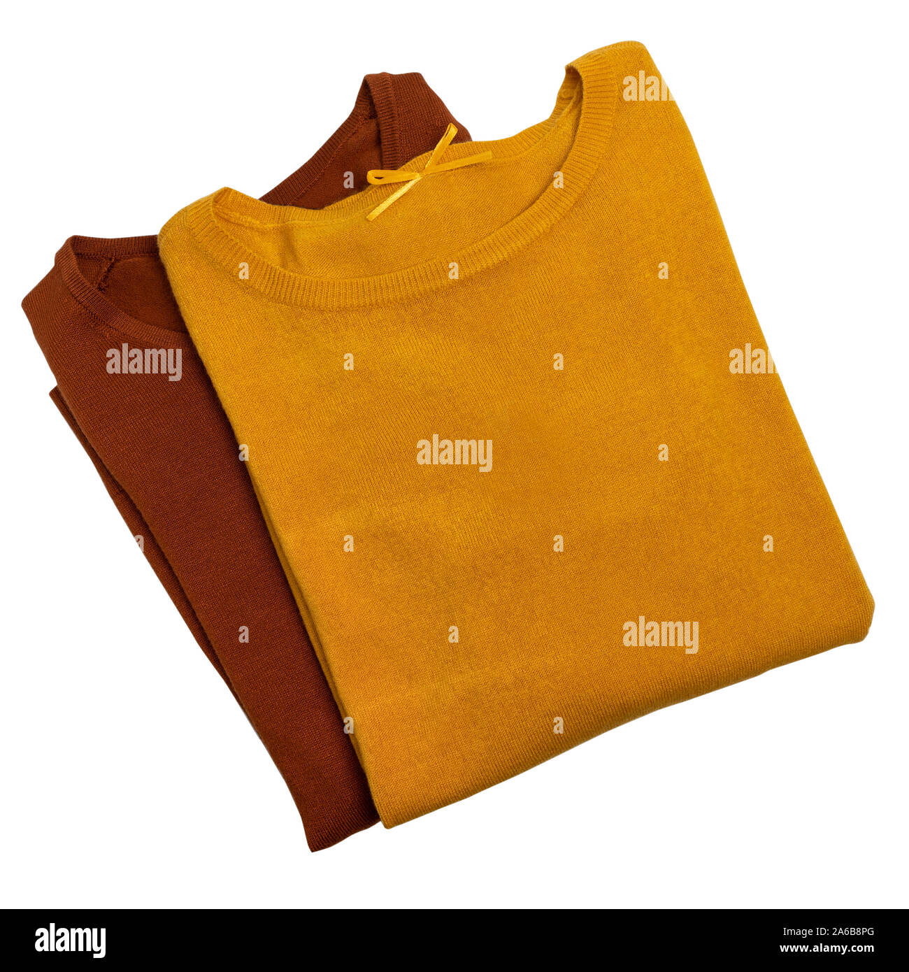Women's clothing set. Brown and yellow sweaters isolated on background