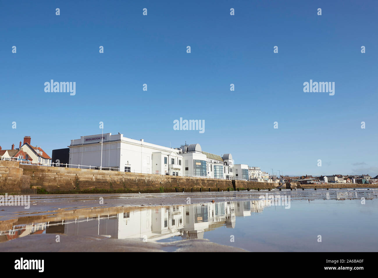 Bridlington spa theatre on the south promenade reflected in the sands of the south beach, East Yorkshire, England, UK Stock Photo