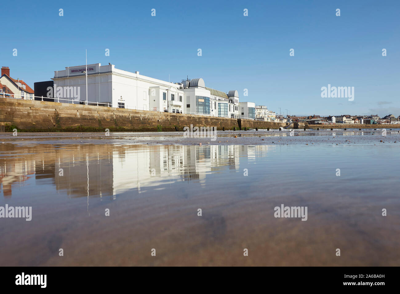 Bridlington spa theatre on the south promenade reflected in the sands of the south beach, East Yorkshire, England, UK Stock Photo
