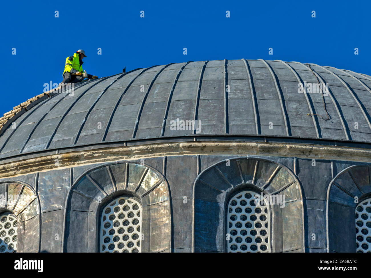 ISTANBUL TURKEY SULTAN AHMED OR BLUE MOSQUE EXTERIOR MAN WORKING ON THE ...