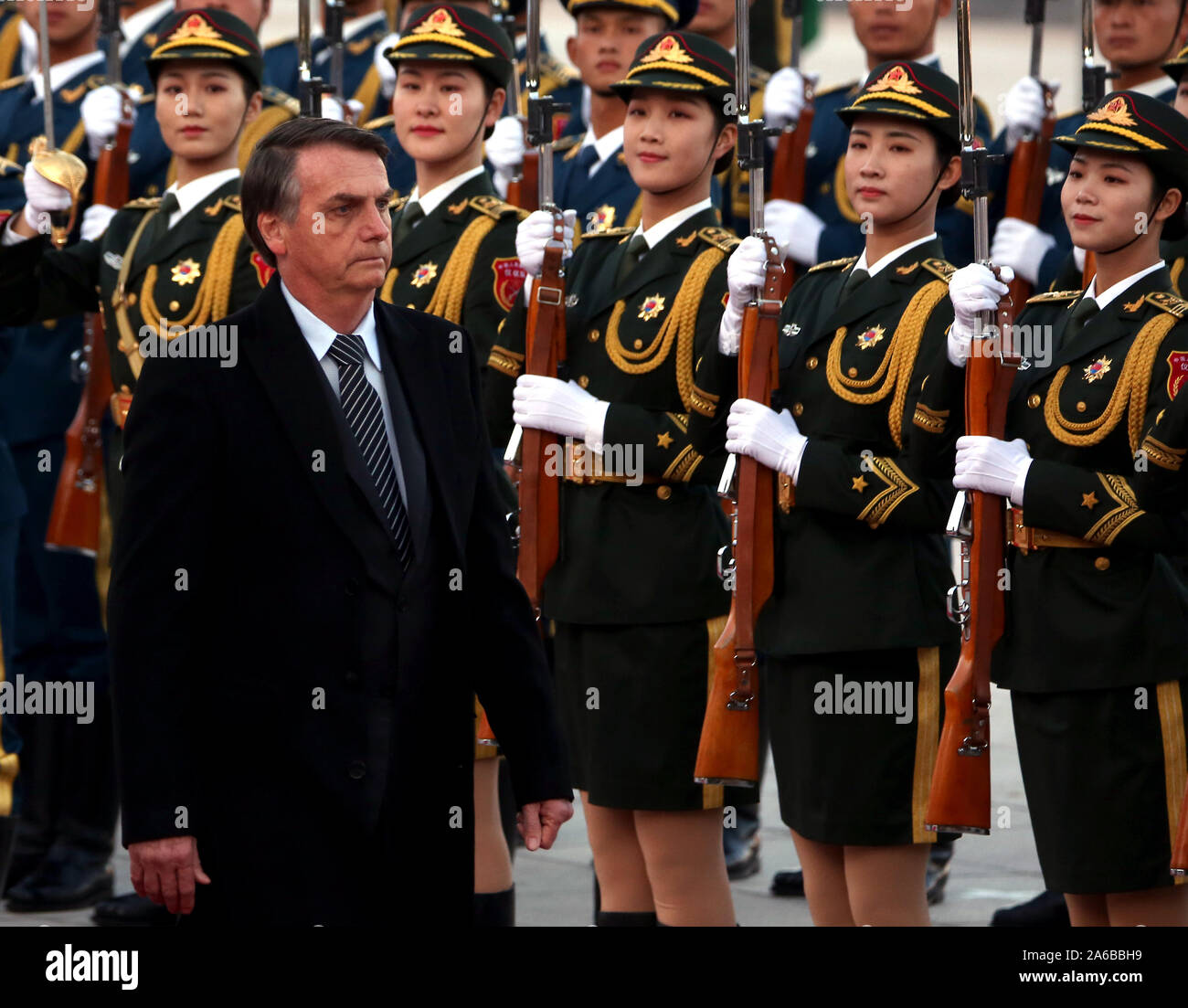 Beijing, China. 25th Oct, 2019. Brazilian President Jair Bolsonaro inspects a military honor guard during a welcoming ceremony at the Great Hall of the People in Beijing on Friday, October 25, 2019. Bolsonaro told a forum that China and Brazil 'were born to walk together' and the two governments are 'completely aligned in a way that reaches beyond our commercial and business relationship.' Photo by Stephen Shaver/UPI Credit: UPI/Alamy Live News Stock Photo