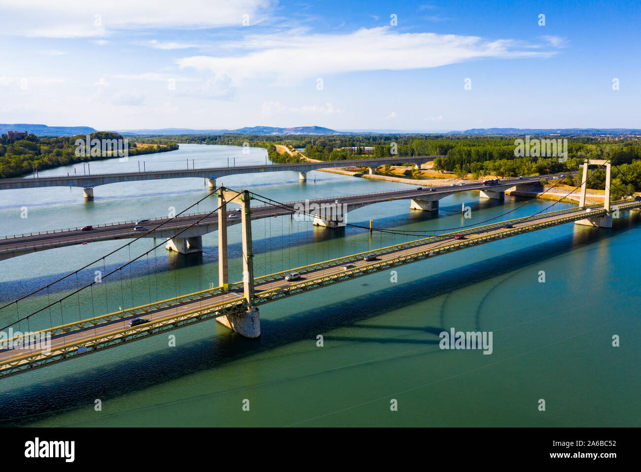 Picturesque aerial view of Rhone river with three bridges near small