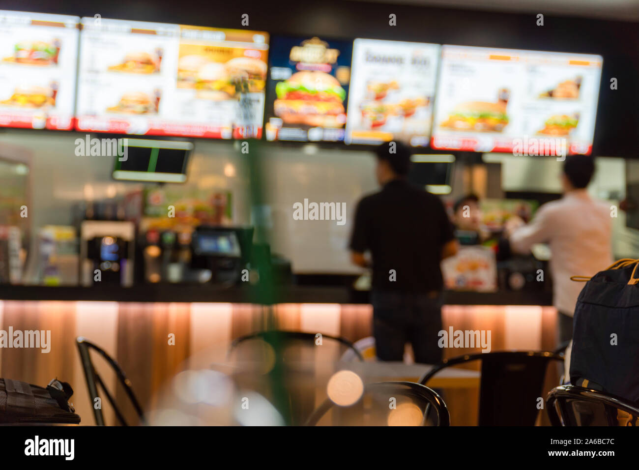 Blurred image of a fast food restaurant, also known as a quick service restaurant within the airport. Stock Photo