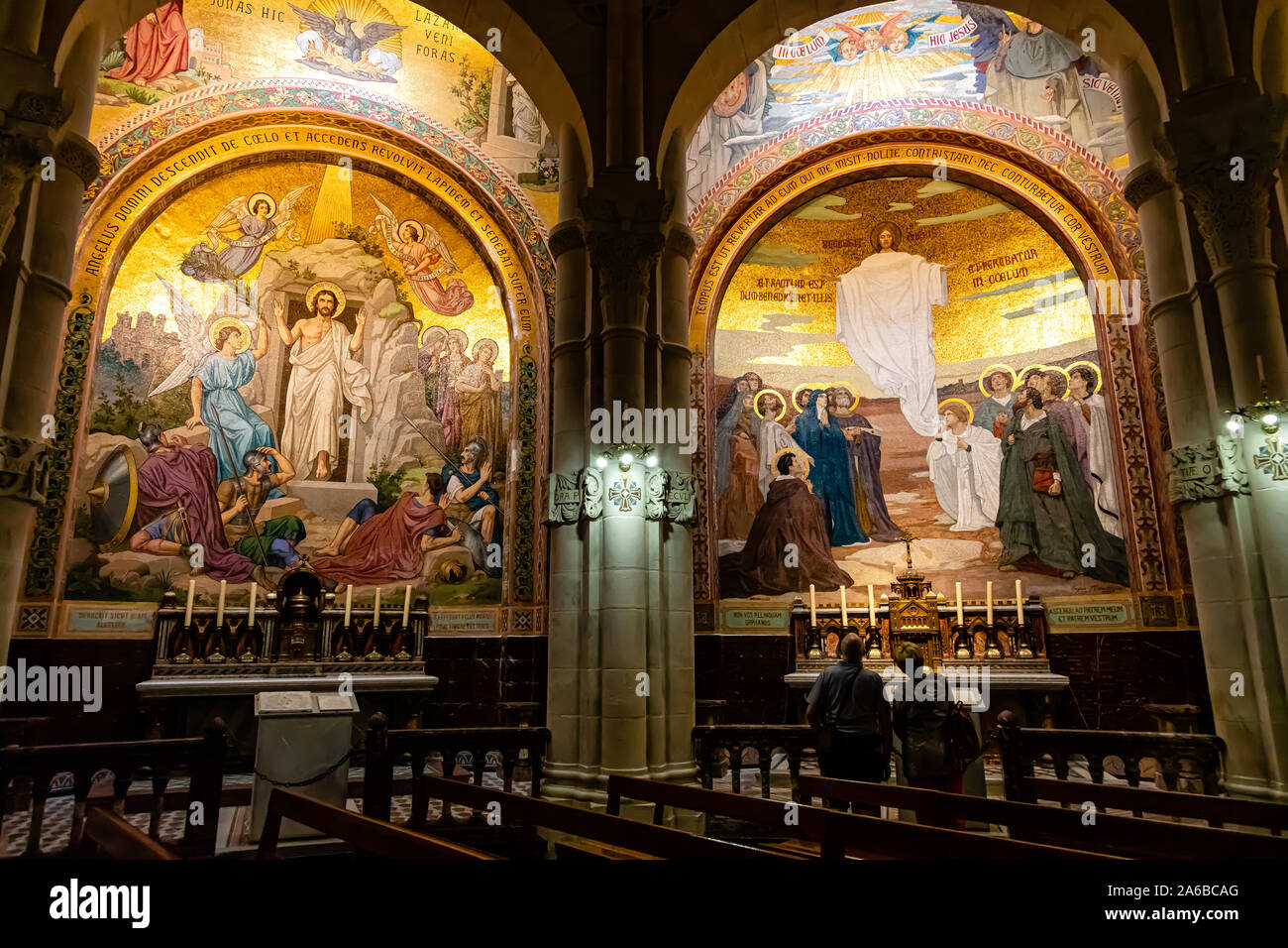 LOURDES, FRANCE - JUNE 15, 2019: Chapel inside the Rosary Basilica in Lourdes displaying Christian murals Stock Photo
