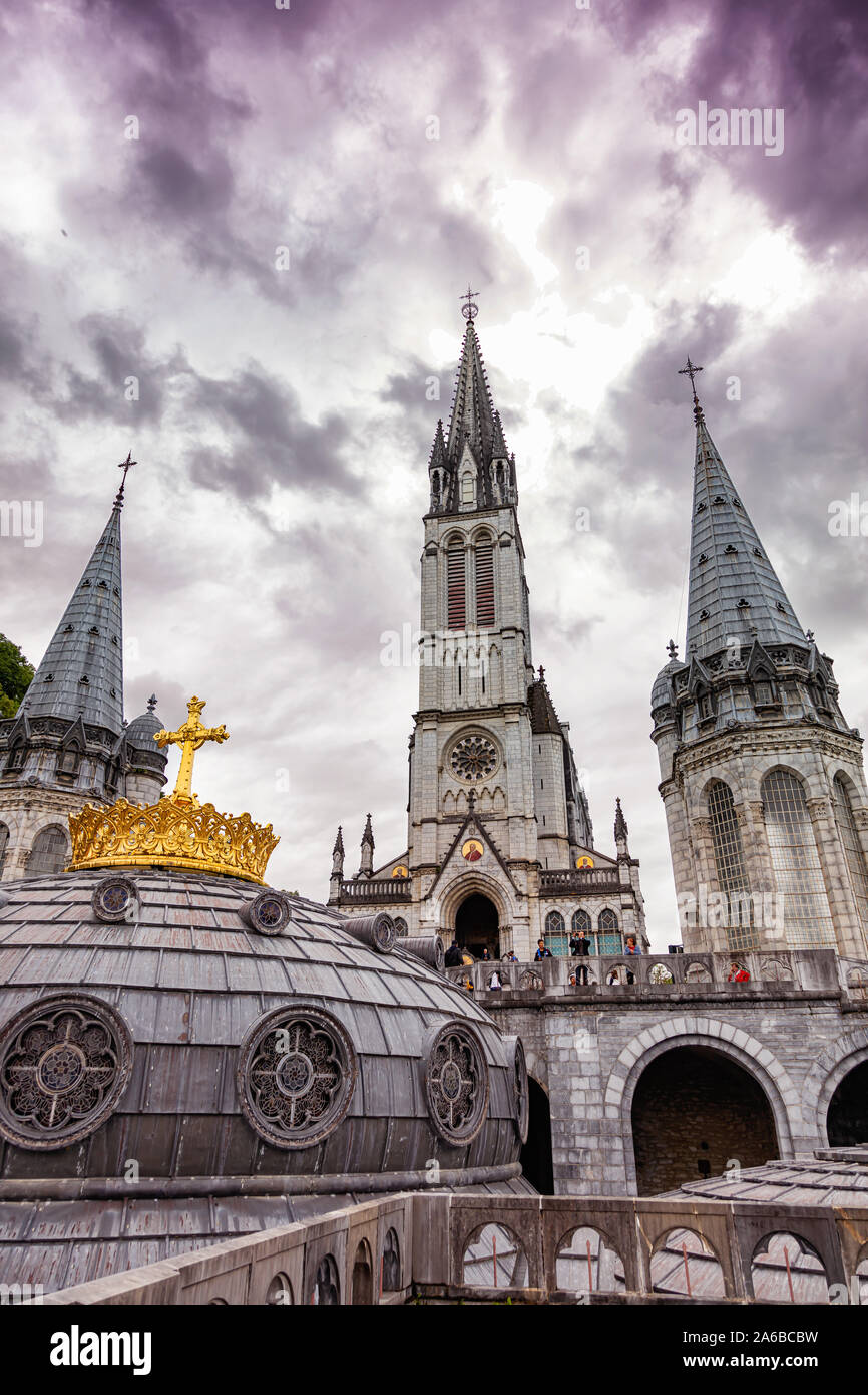 LOURDES - JUNE - 15 - 2019: Christian cross on a background the