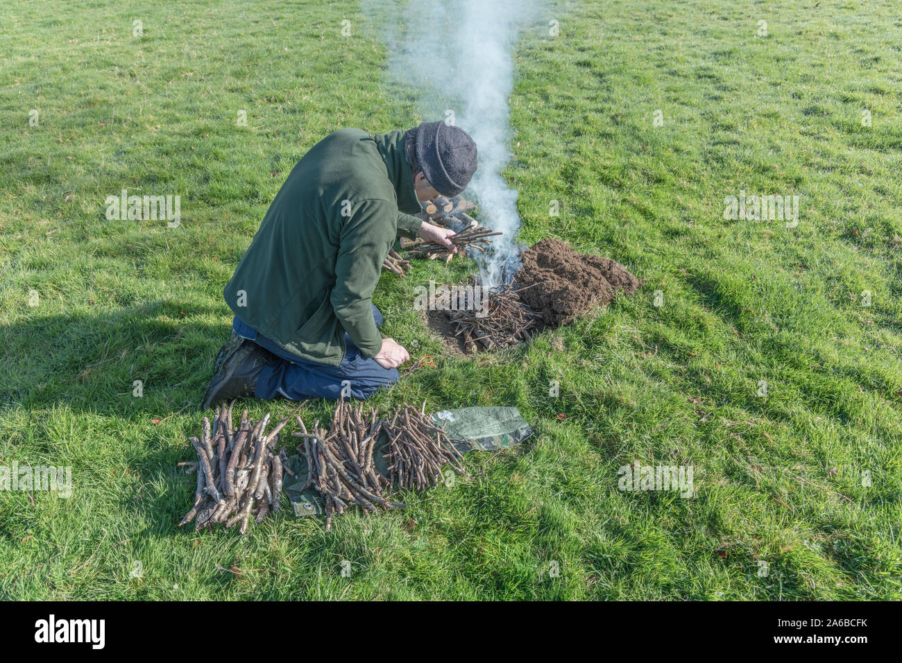 Lighting a fire pit hires stock photography and images Alamy