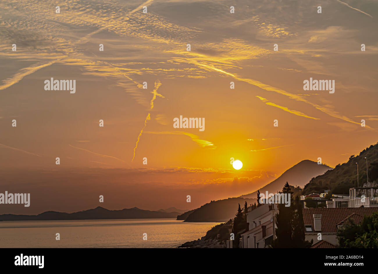 Sunset over coastline Stock Photo