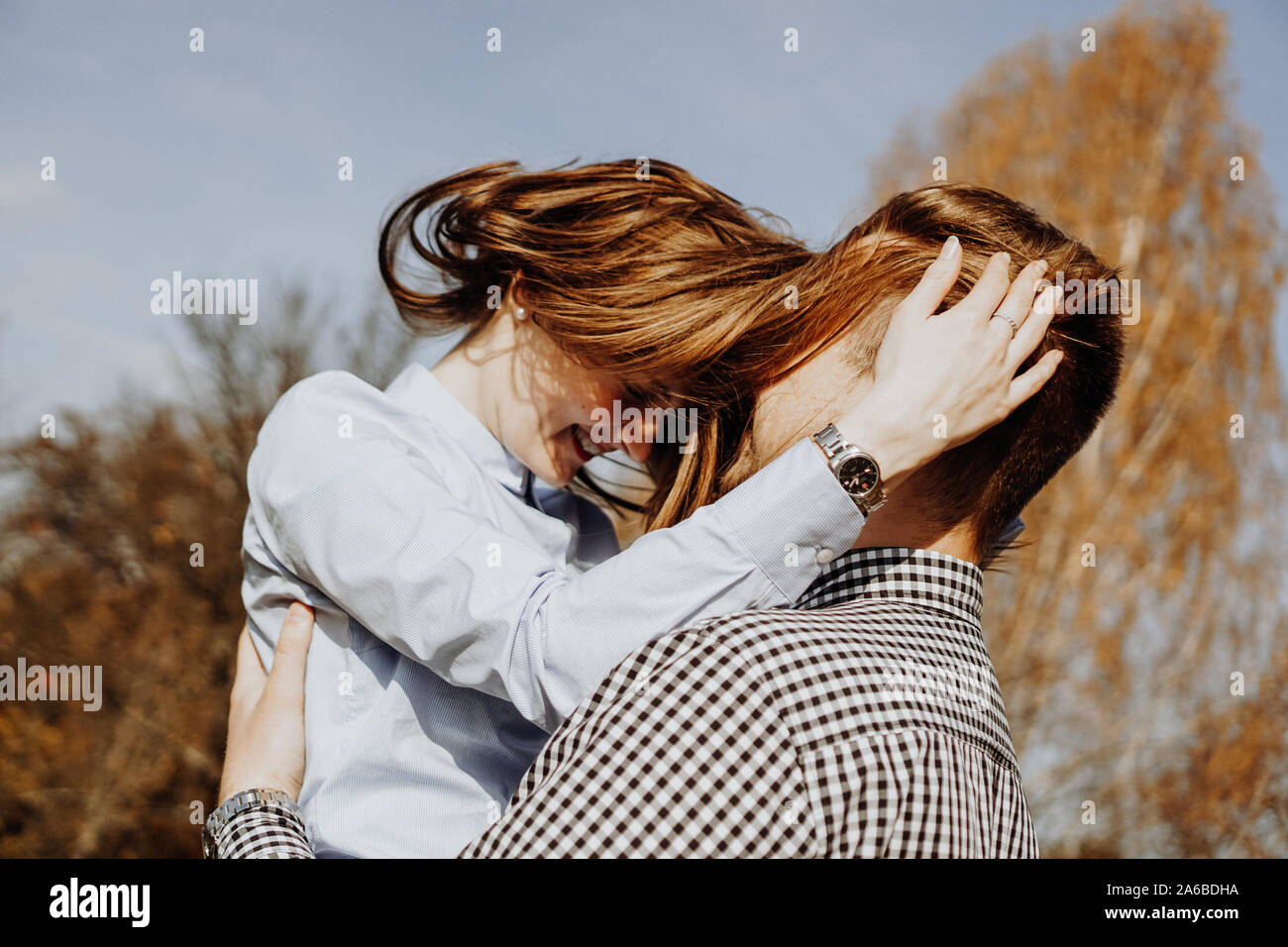 Cute couple having fun in autumn park - selective focus. Love concept Stock Photo