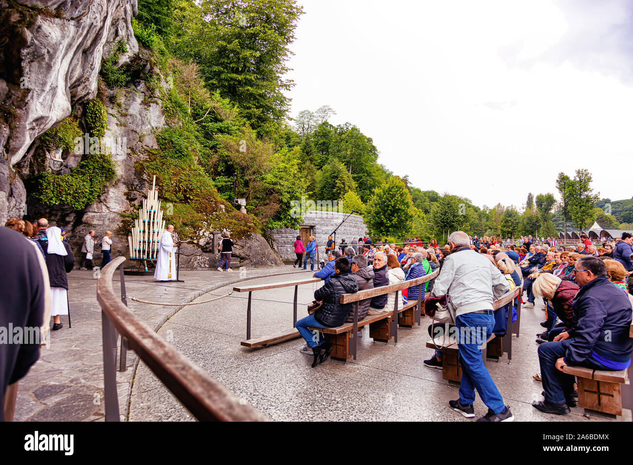 LOURDES - JUNE 15, 2019: view of the cave, the cathedral and the ...