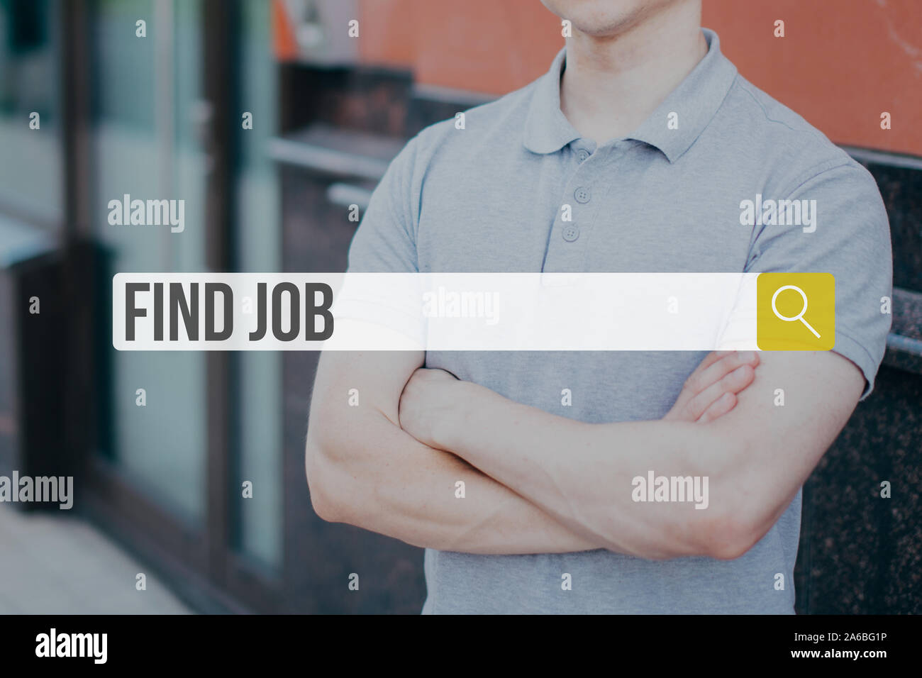The concept of job search on the Internet. String for entering data on the background of a young man in a t-shirt. Stock Photo