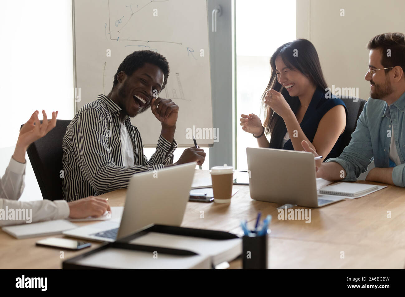 Diverse team having work meeting hi-res stock photography and images ...