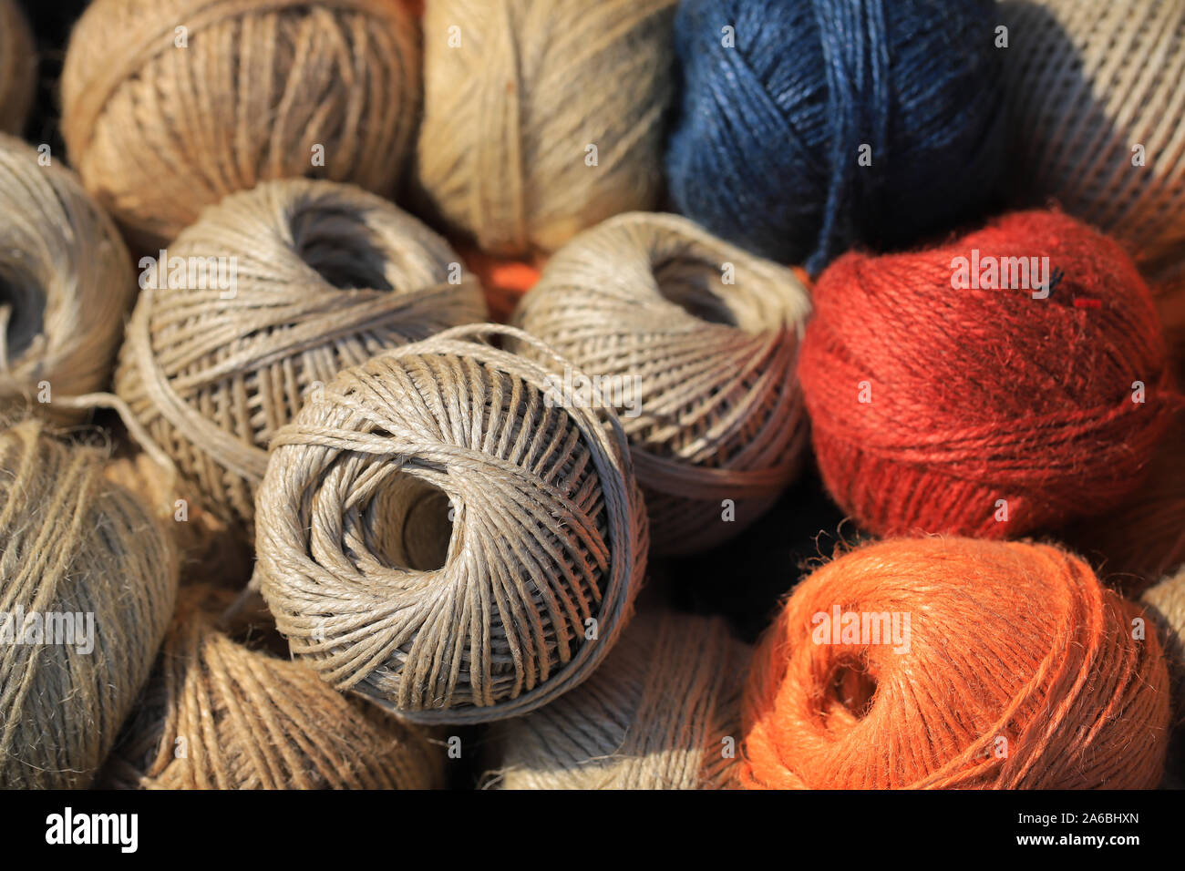 Colored cotton thread balls background Stock Photo