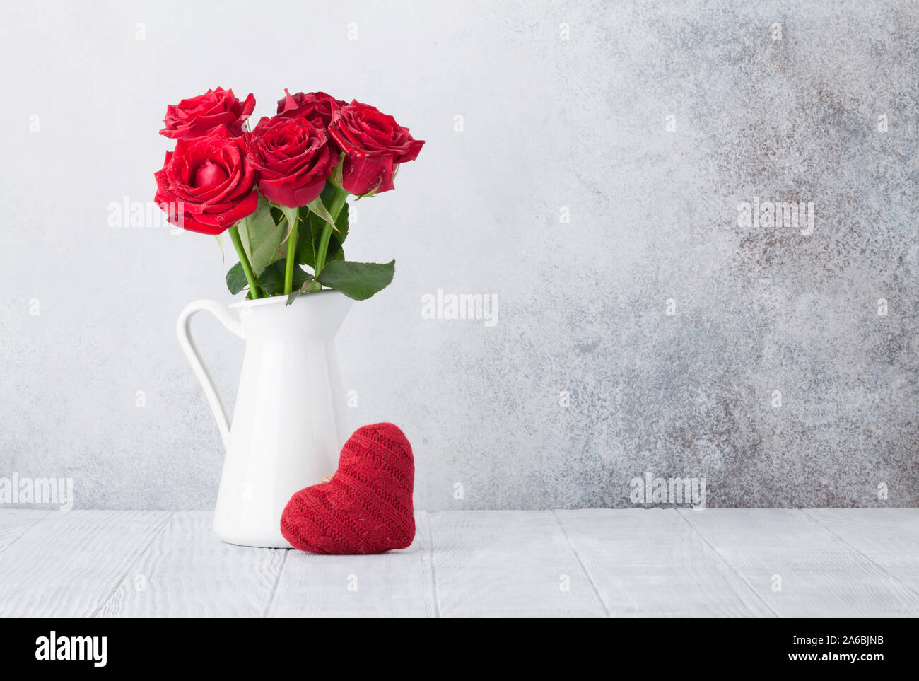 Valentine's day greeting card with red rose flowers bouquet and knitted ...