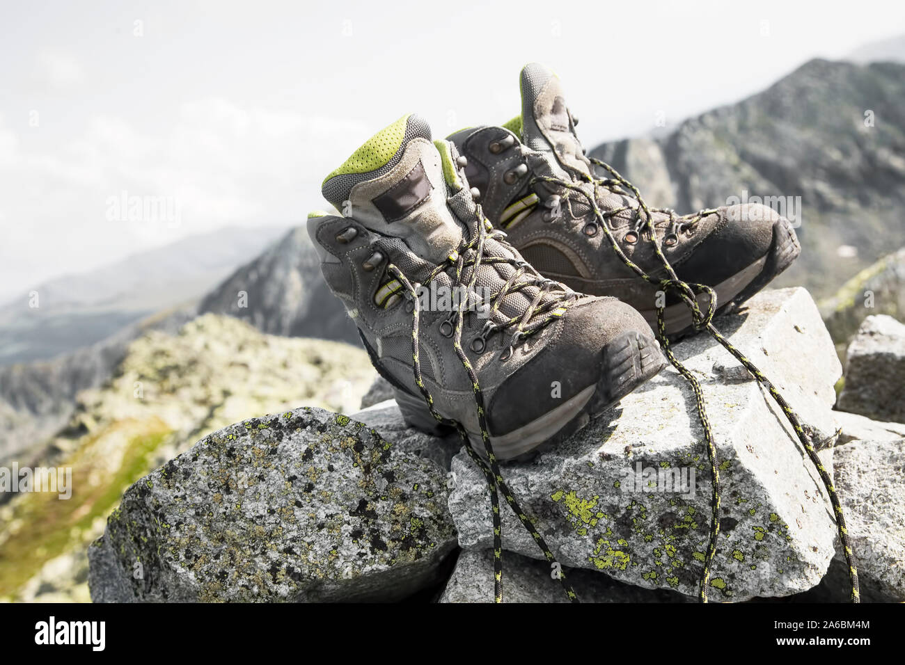 Mountain hiking boots on top of the mountain peak Stock Photo - Alamy