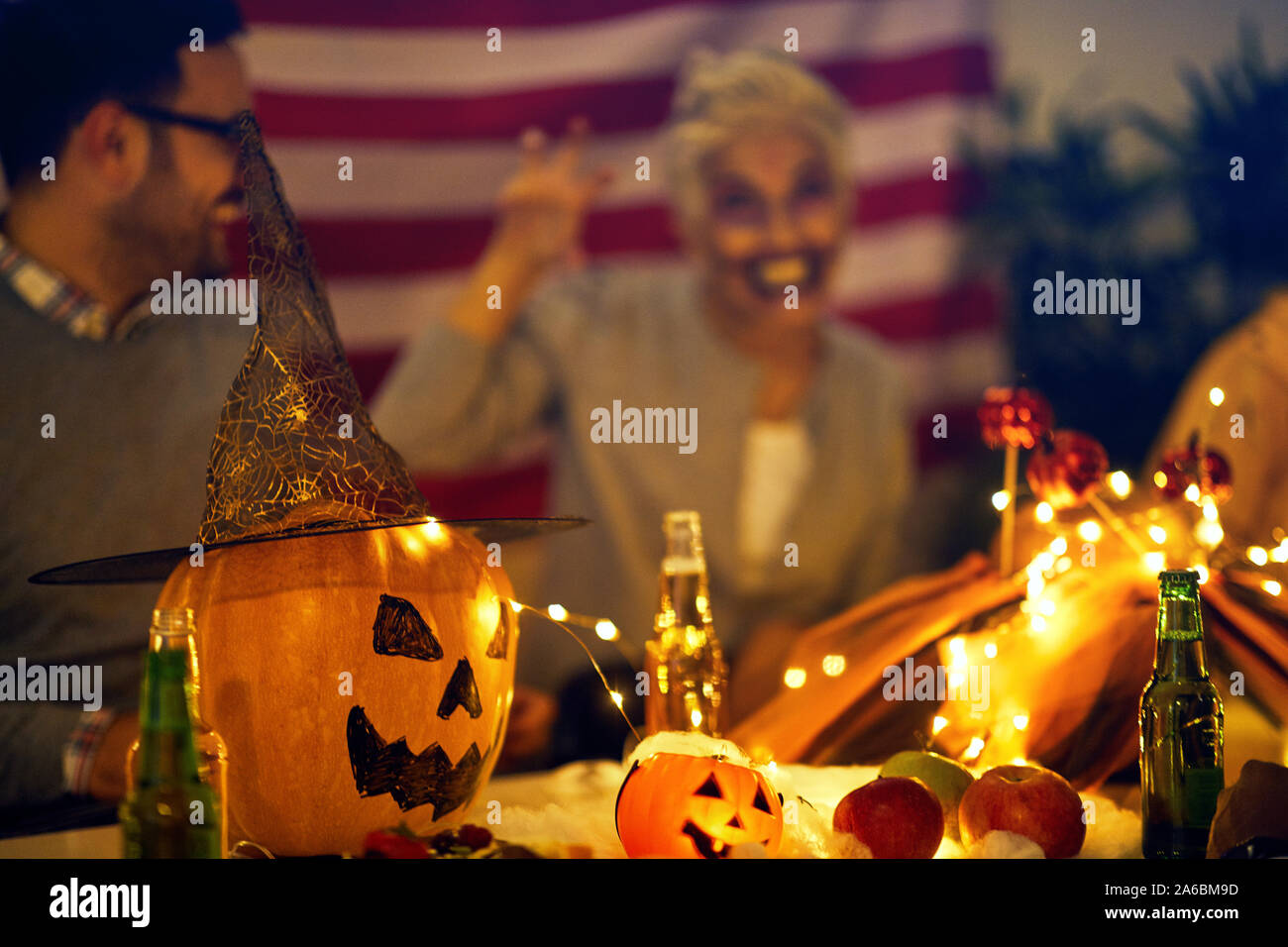 Halloween decorations -  pumpkin and String Lights On Table Stock Photo