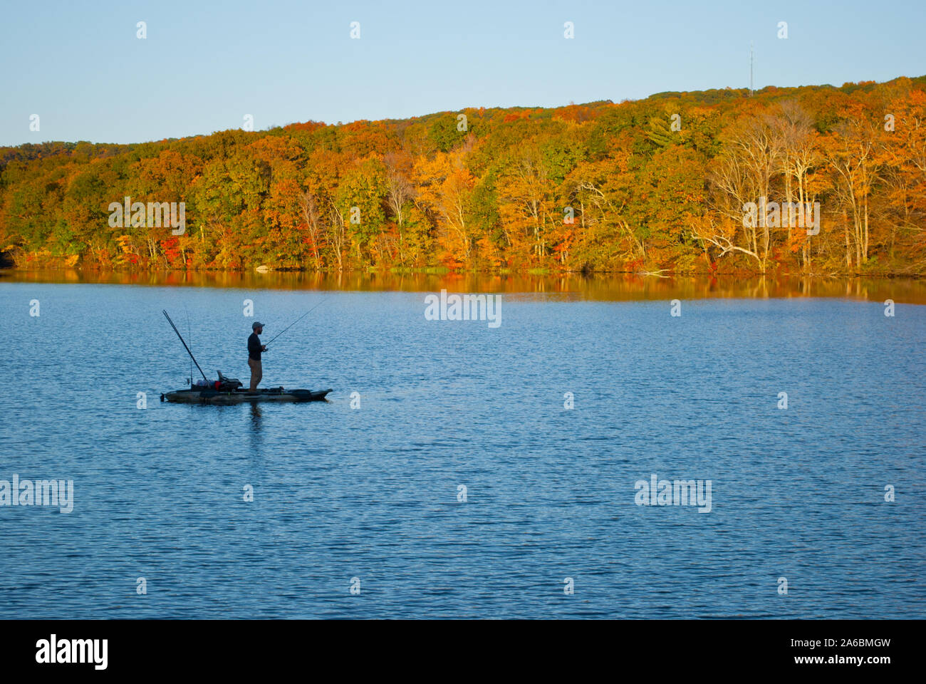 Fishrman in Risley Park Vernon Connecticut during autumn fall with beautfull October foliage Stock Photo