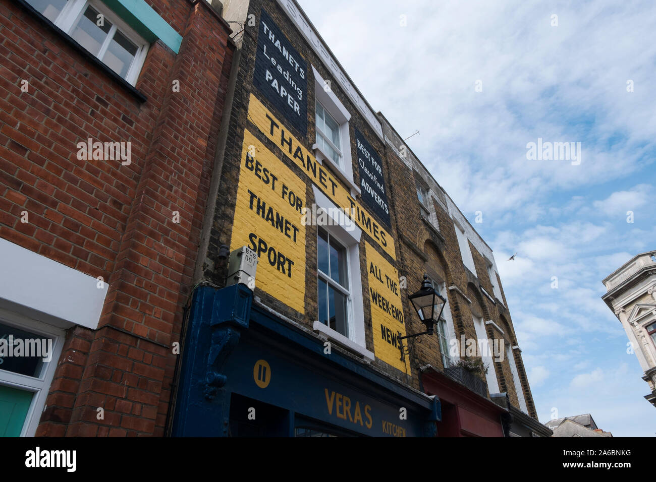 Thanet Times newspaper sign on the wall above Vera's Kitchen tea room and restaurant in Broad Street, Margate, Kent UK Stock Photo
