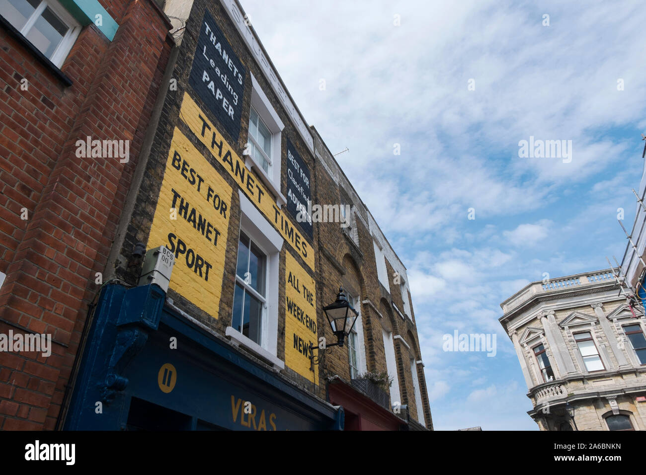 Thanet Times newspaper sign on the wall above Vera's Kitchen tea room and restaurant in Broad Street, Margate, Kent UK Stock Photo