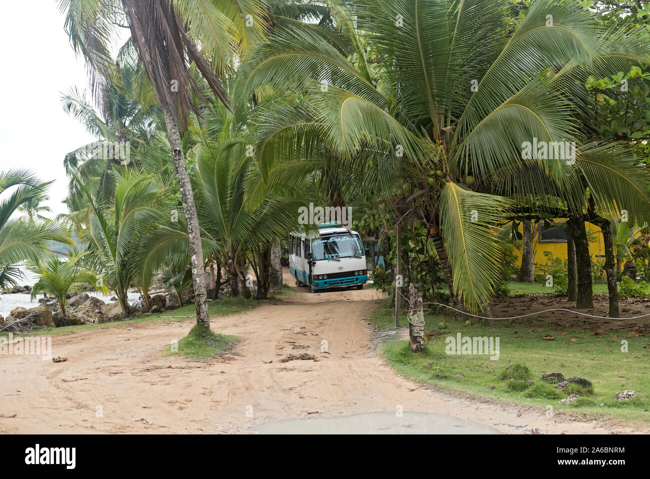 minibus taxi on the coastal piste on the beach of boca del drago panama Stock Photo