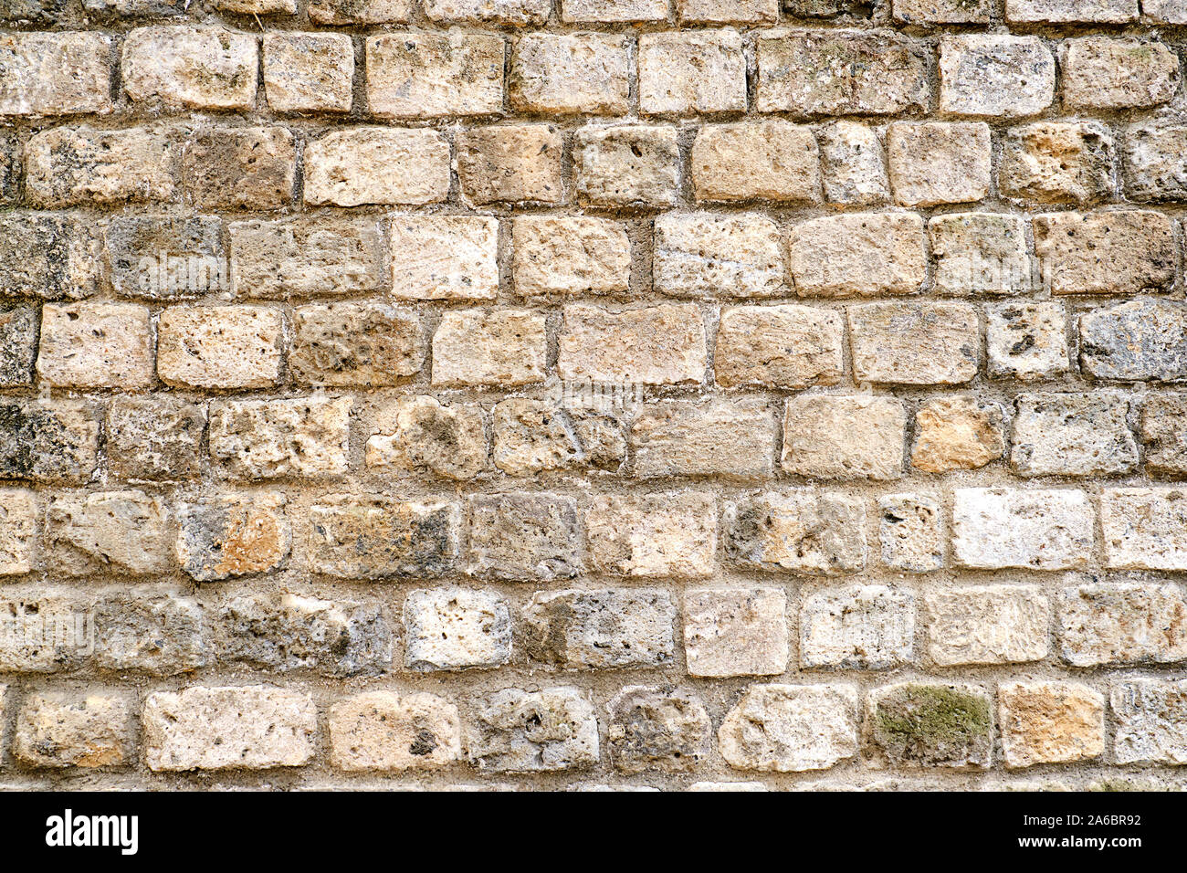 Background from a rough brown natural stone wall Stock Photo