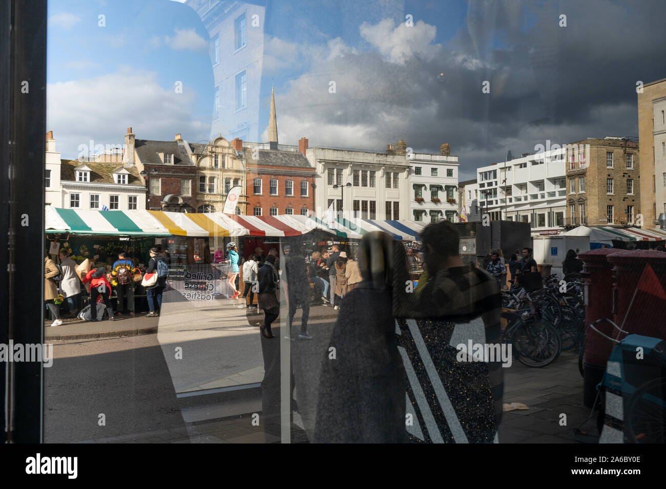 Market reflected in shop window Cambridge 2019 Stock Photo