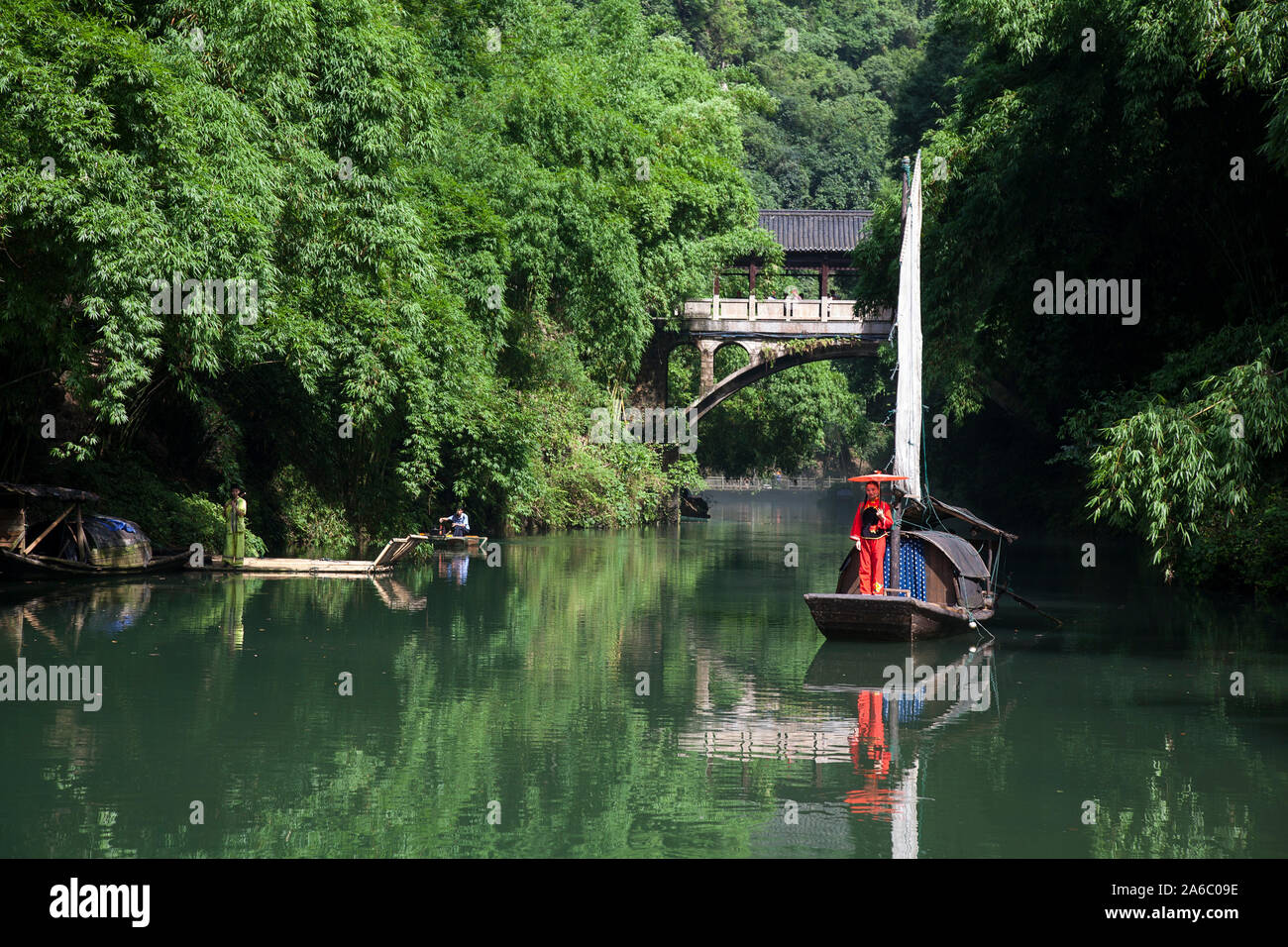 Chinese woman in traditional dress on boat at Tribe of The Three Gorges on Yangtze River China Stock Photo