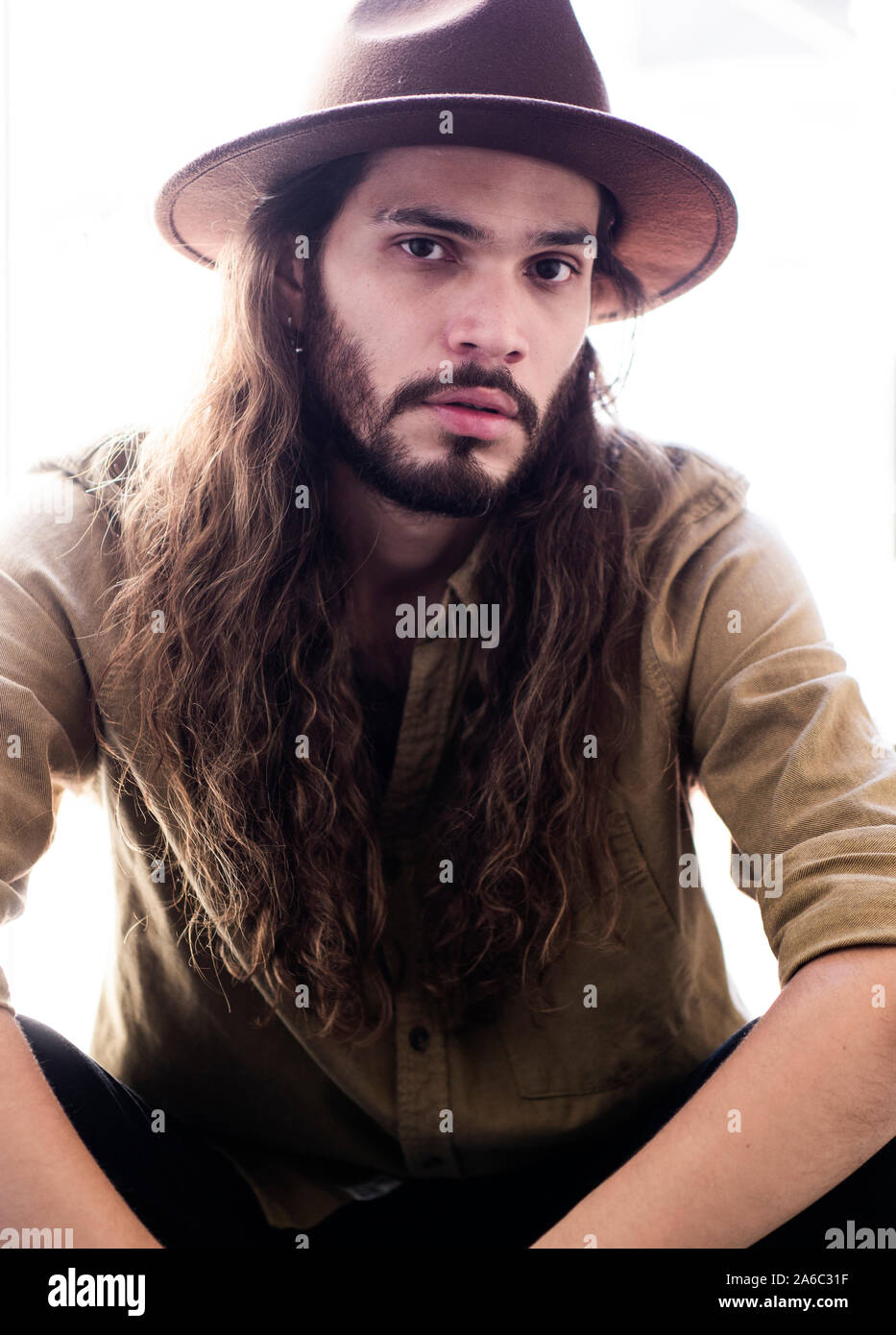 Hispanic man wearing cowboy hat hi-res stock photography and images - Alamy