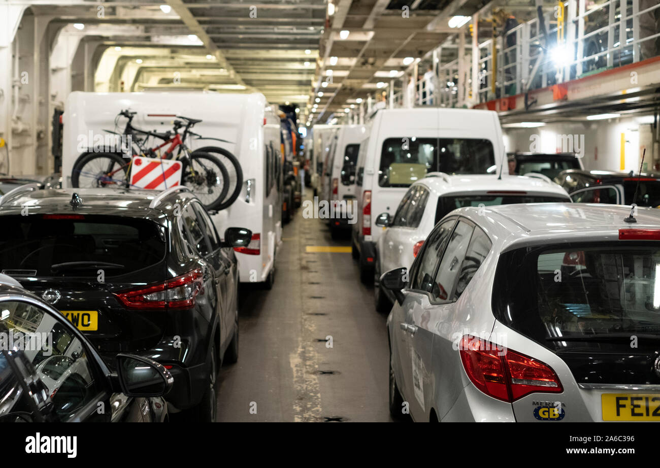 Cross channel ferry vehicle deck, motorhomes and cars packed onto a ship going to the UK Stock Photo