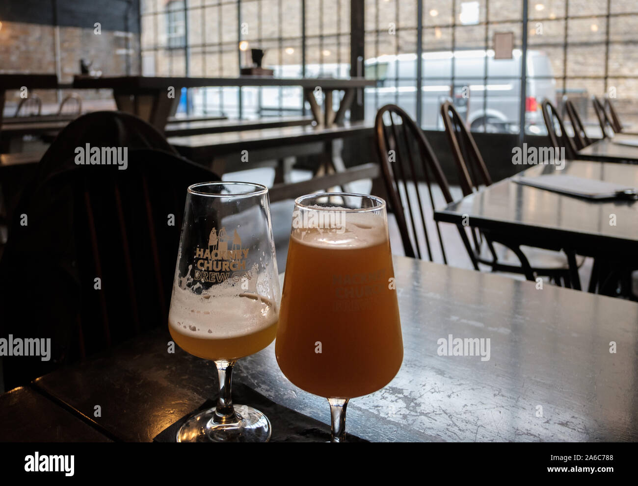 Glasses of Joosy Pale Ale at the Hackney Church Brew Co, a microwbrewery under the railway arches at Bohemia Place, Hackney, East London Stock Photo