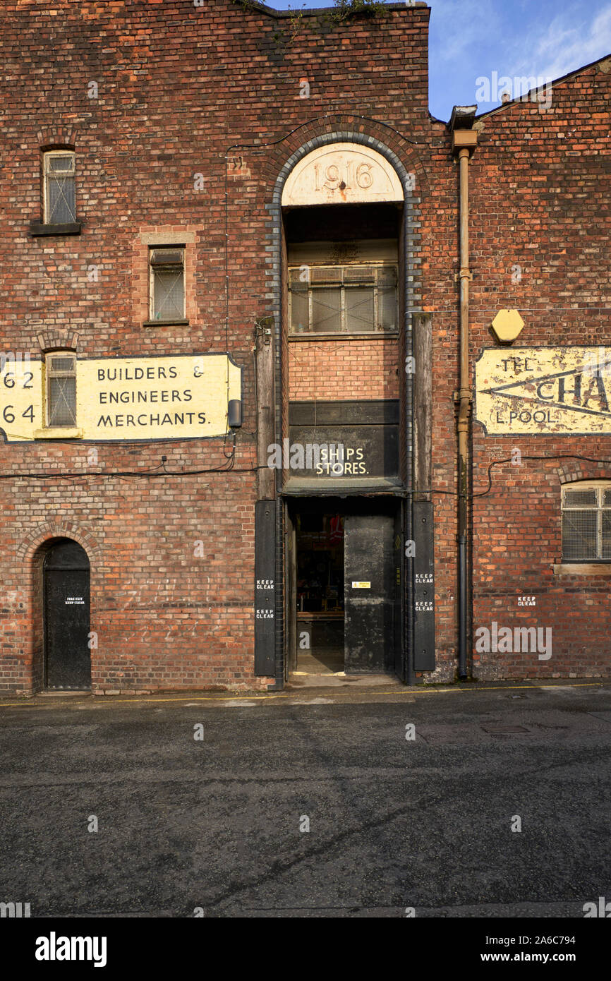 Older warehouse building in the Baltic Triangle part of Liverpool that is currently being used as a ships stores Stock Photo