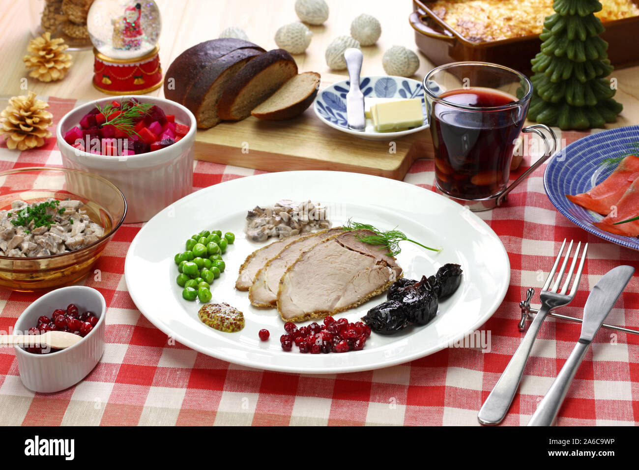 traditional finnish christmas food, christmas ham, beets salad, smoked salmon, mushroom salad, potato casserole, mulled wine Stock Photo