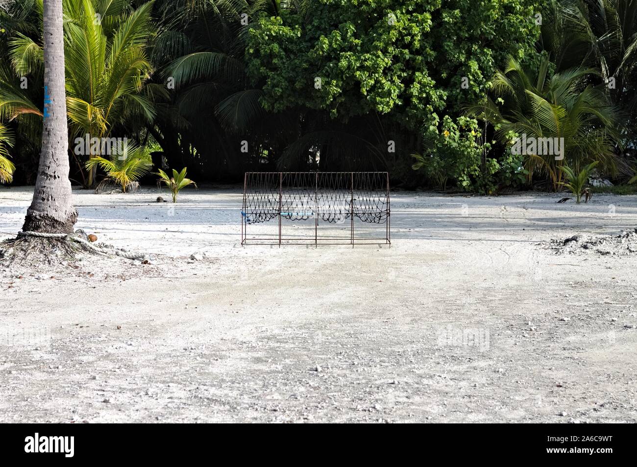 Isolated typical maldivian bench in the tropical forest (Ari Atoll ...