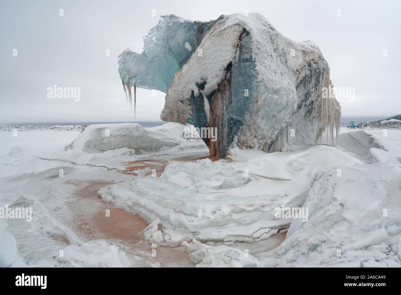 Parts of a glacier looking bloody. Ferrous sediments have stained the glacier red, Dunérbukta, Svalbard, Norway Stock Photo