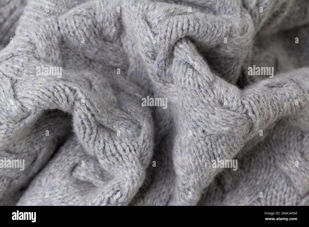 Texture of gray knitted fabric close up. Wool knitwear Stock Photo - Alamy