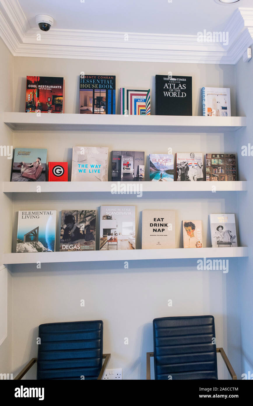 Creative And Decorative Books On Display On Shelves Stock Photo