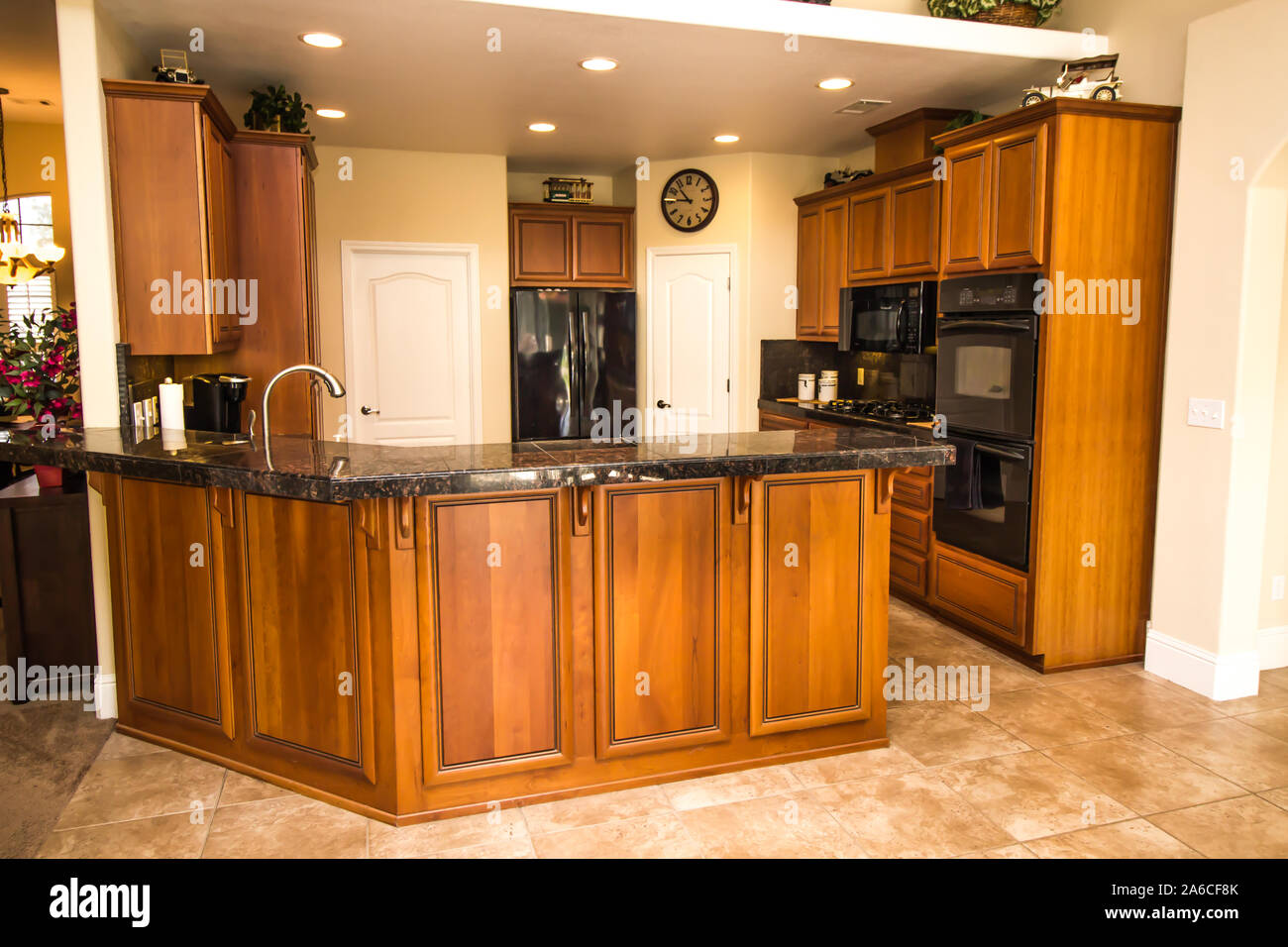 Black Granite Counter Kitchen With Rich Wood Stock Photo Alamy
