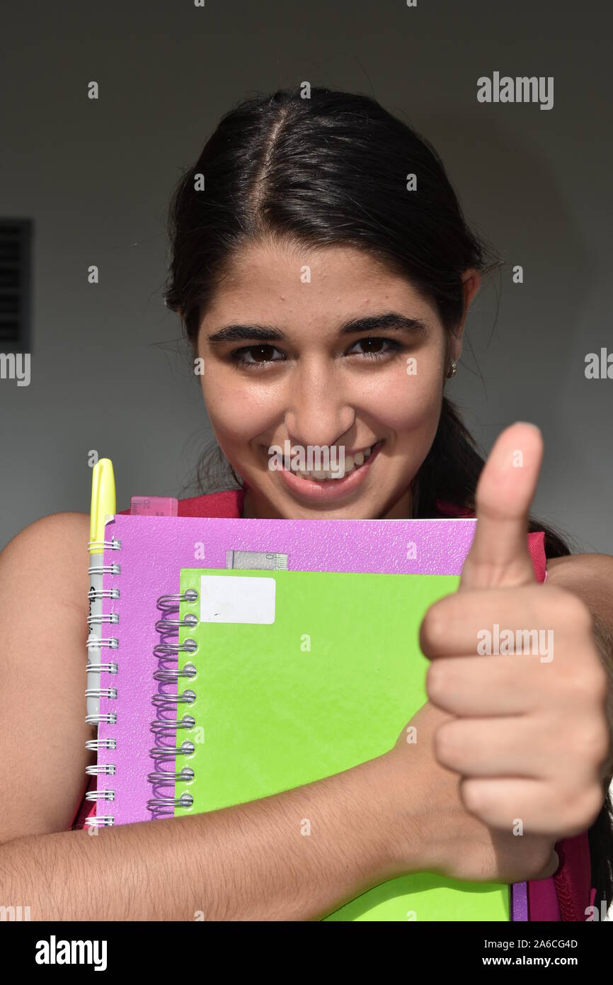 Girl Student With Thumbs Up Stock Photo - Alamy