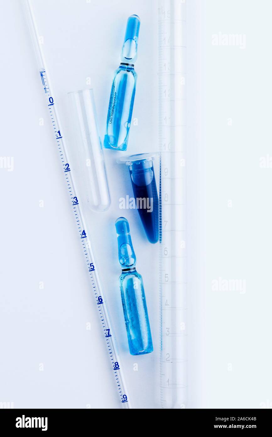 Pharmaceutical research, conceptual image. Vials, centrifuge tubes and other laboratory glassware. Stock Photo