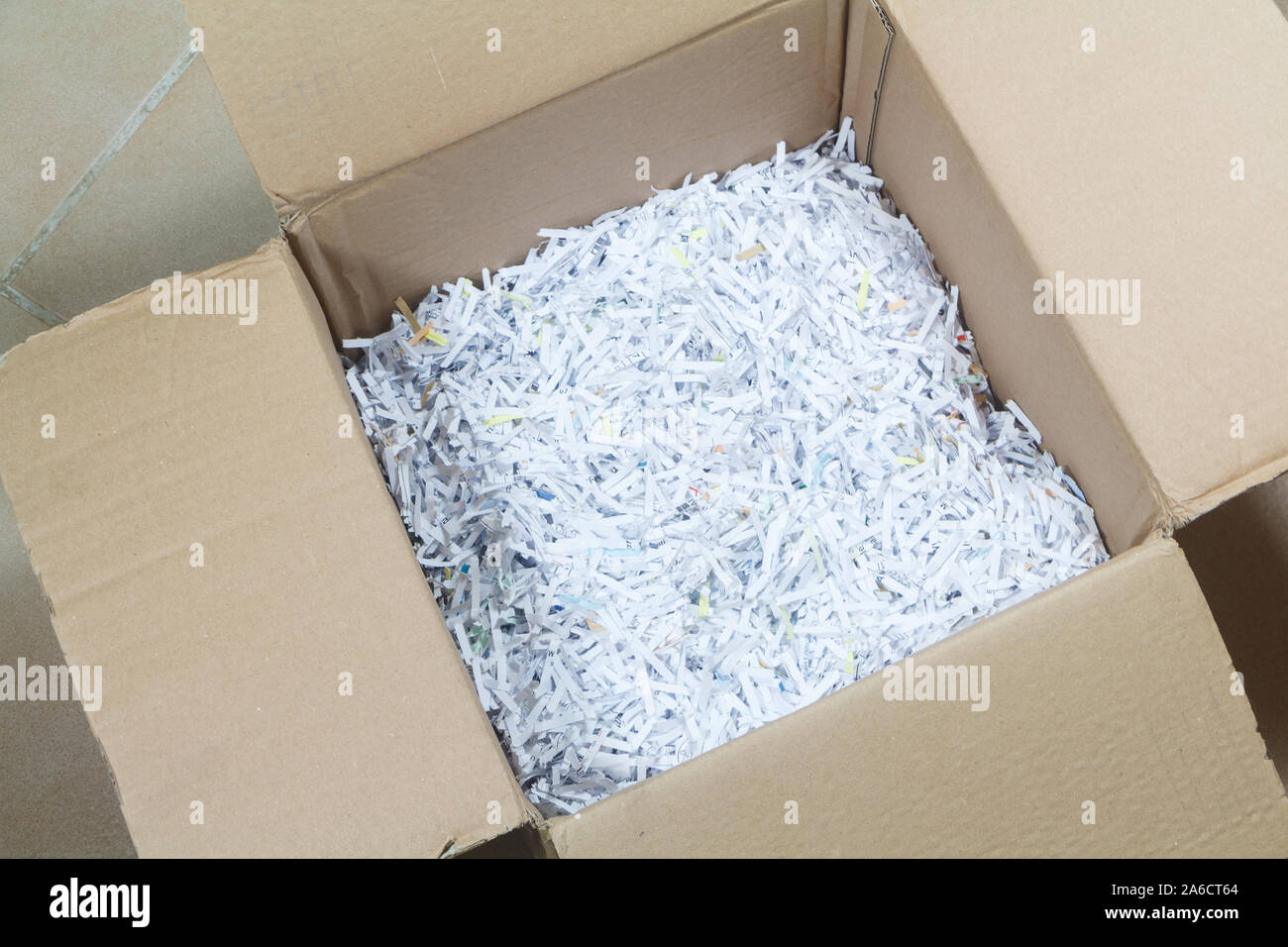 Shredded paper in a cardboard box for shipping goods Stock Photo Alamy