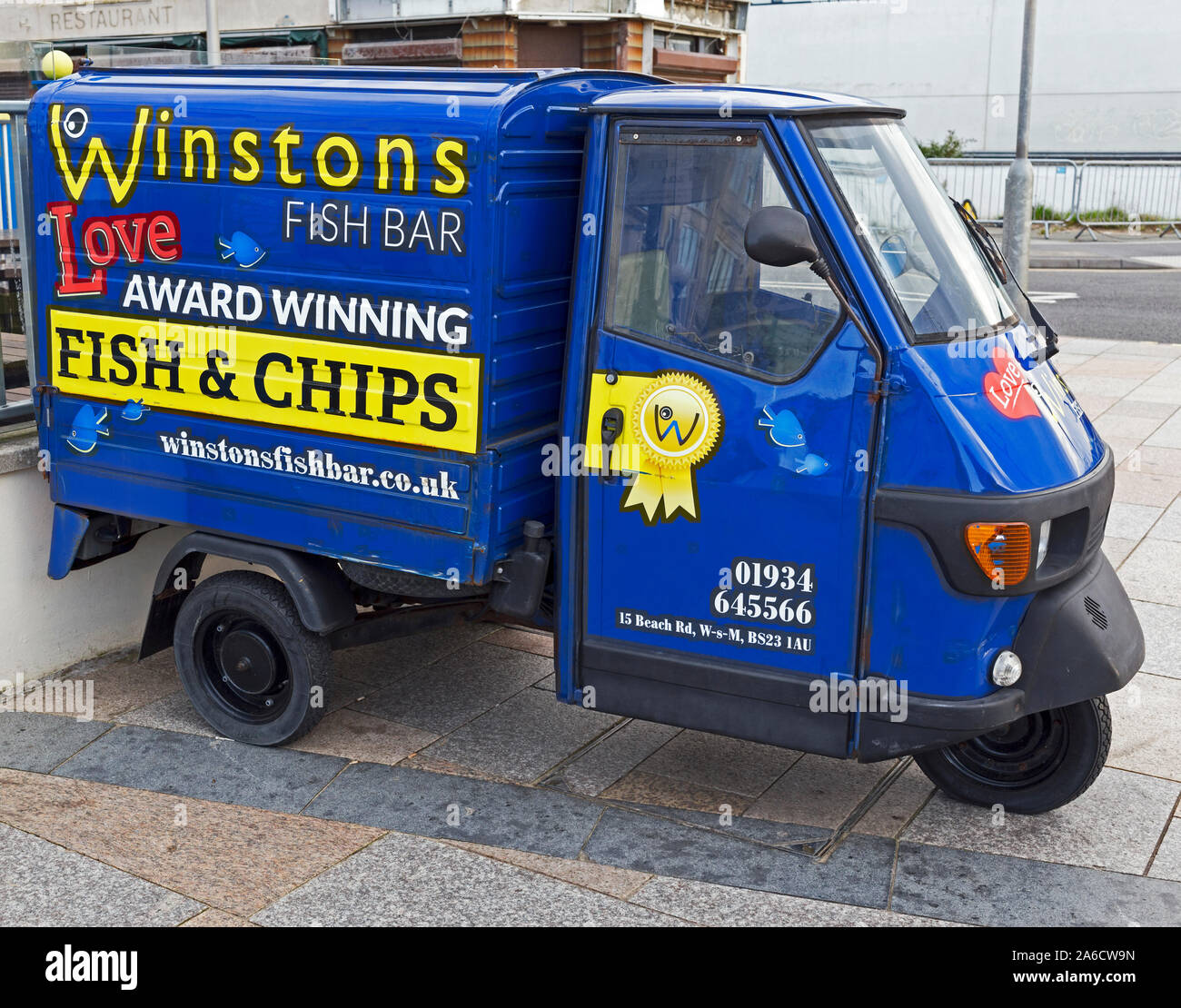 A three-wheeled van advertising Winston’s Fish Bar in Weston-super-Mare, UK Stock Photo