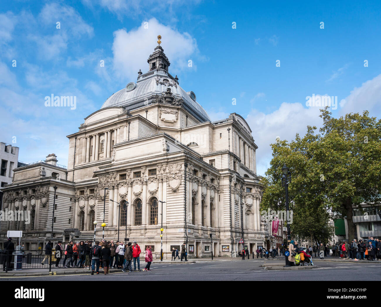 Tourists in the street outside Methodist Central Hall, Westminster, London, UK Stock Photo